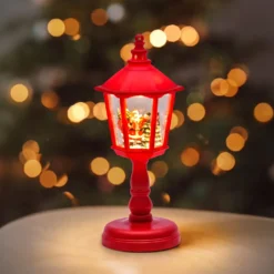 Lampione rosso, glitter scintillanti, h 21 cm, led bianco caldo, musiche natalizie