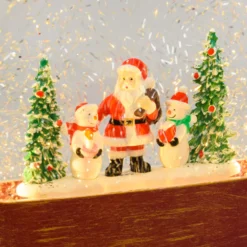 Lanterna in vetro rosso antico, paesaggio con nevicata glitter, h 19 cm, led bianco caldo