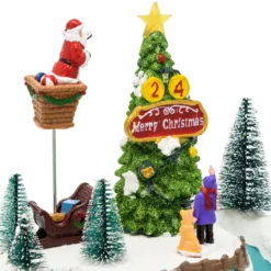 Villaggio di Natale, Albero e Babbo che lo decora in movimento, h 22 cm