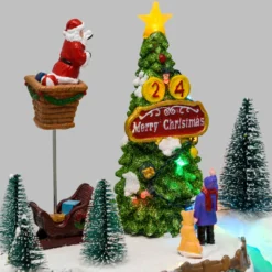Villaggio di Natale, Albero e Babbo che lo decora in movimento, h 22 cm