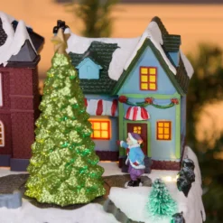 Villaggio Innevato con Chiesa e Trenino, Albero e Giostra per Bambini rotanti, h 27 cm, musiche natalizie